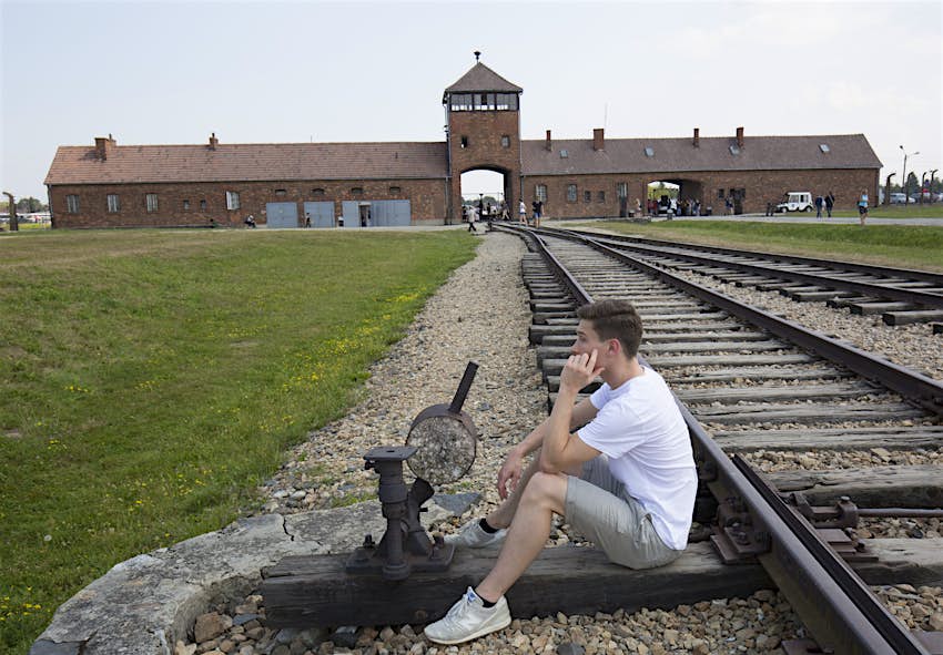 Young Man At Auschwitz Birkenau Holocaust Museum ?auto=format&fit=crop&sharp=10&vib=20&ixlib=react 8.6.4&w=850